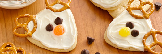 A Reindeer Cookie With Pretzel Decoration