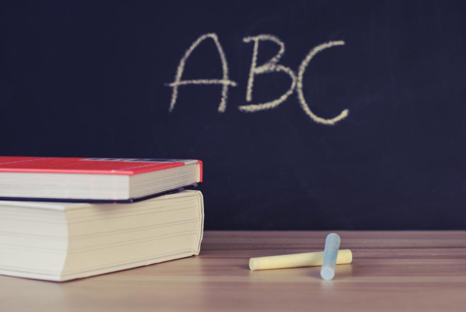 A Black Board With ABC Written on it