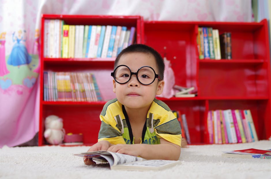 A Boy With Large Black Color Glasses